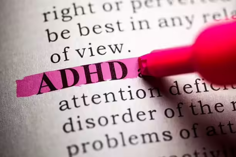 ADHD term highlighted in text, representing attention deficit hyperactivity disorder
