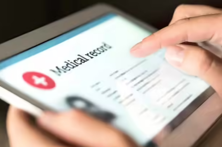 Person accessing digital medical records on a tablet device