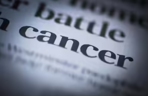 Close-up view of the word “cancer” highlighting disease awareness and global health concerns