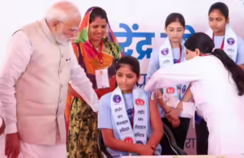 Prime Minister Narendra Modi witnessing HPV vaccination of a schoolgirl during nationwide cervical cancer prevention drive in India
