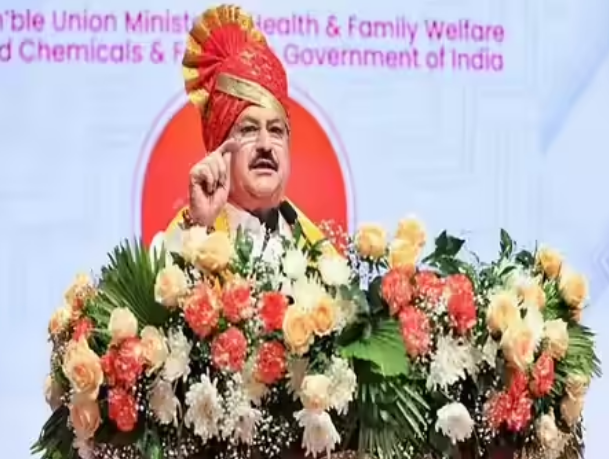 Indian government leader delivering speech at Ministry of Health and Family Welfare event in India with floral decorated podium
