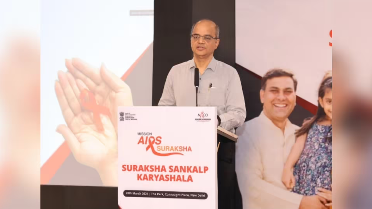 Health official speaking at Suraksha Sankalp Karyashala HIV awareness event under Mission AIDS Suraksha in India