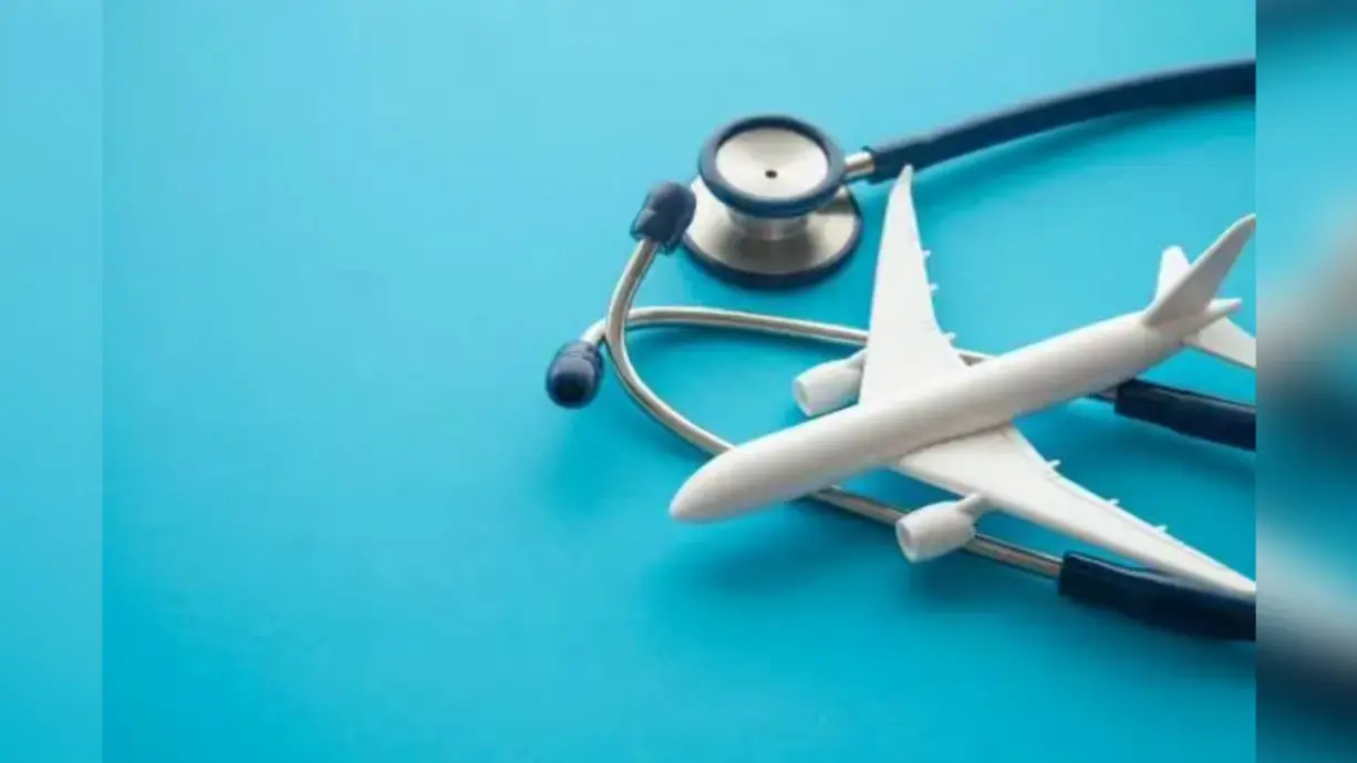 Medical tourism concept with airplane and stethoscope representing international healthcare travel and treatment abroad